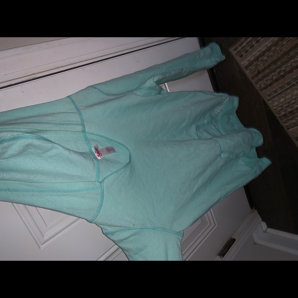 Turquoise Justice hoodie.
